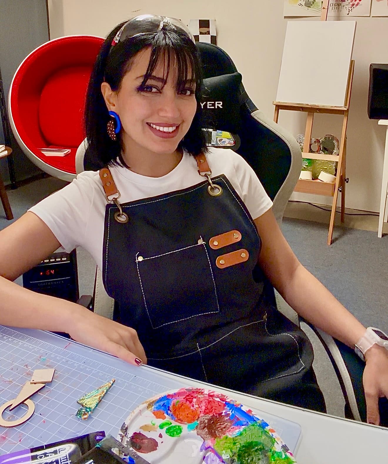 Sheen, the Maylo artisan, hand-painting jewelry in her Seattle studio