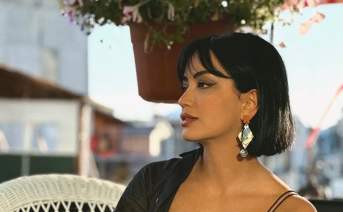 Model wearing Maylo handcrafted geometric earrings